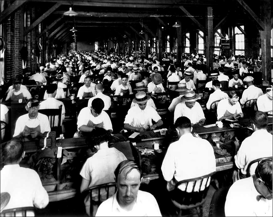 Cigar workers at their benches in Ybor City, Tampa, archival photograph