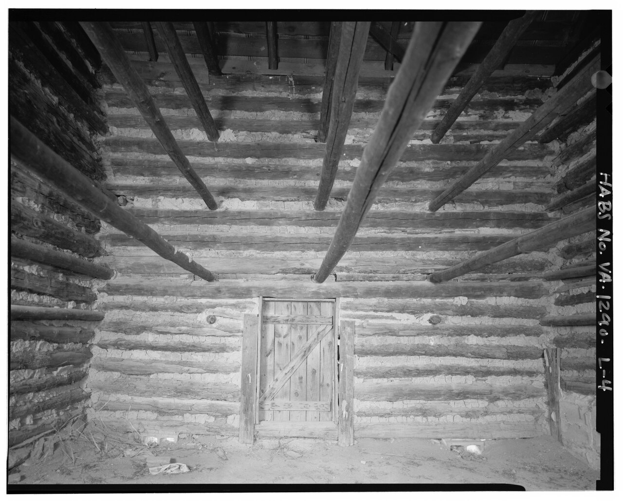 Interior of a tobacco curing barn showing tiers of poles for hanging leaf